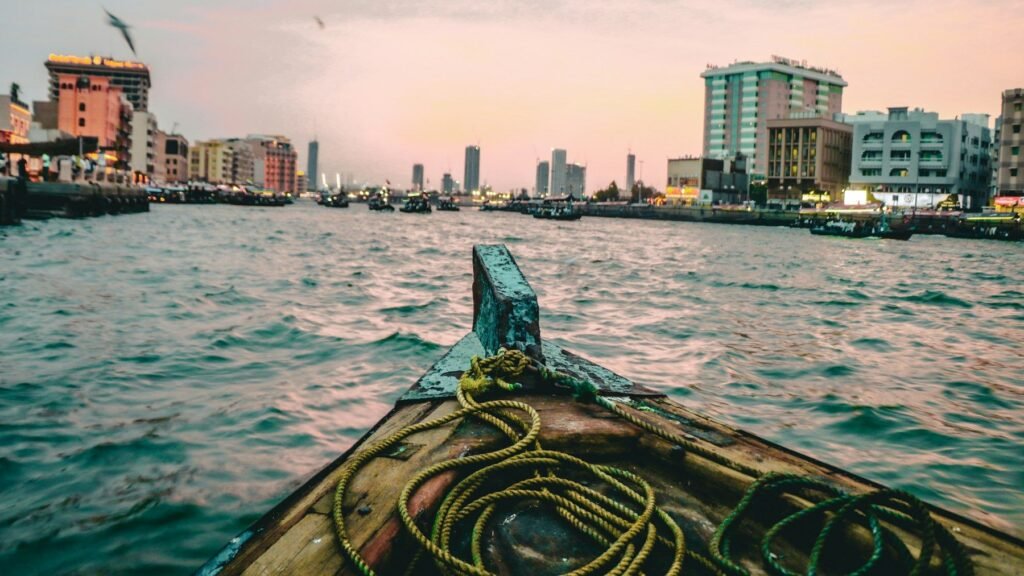 Crossing Dubai Creek by abra at sunset
