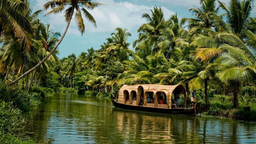 A Kerala houseboat on a palm-lined backwater canal