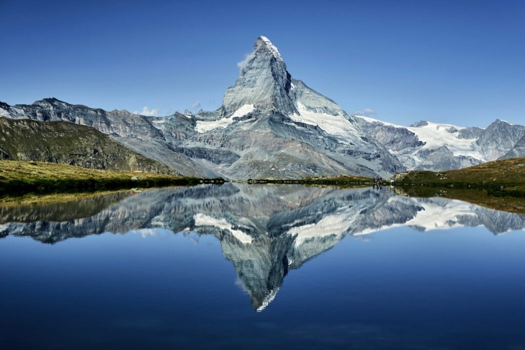 The Matterhorn reflected in an alpine lake above Zermatt
