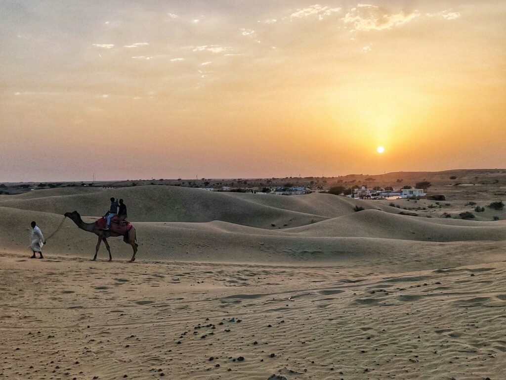 A camel ride on the Sam sand dunes near Jaisalmer at sunset