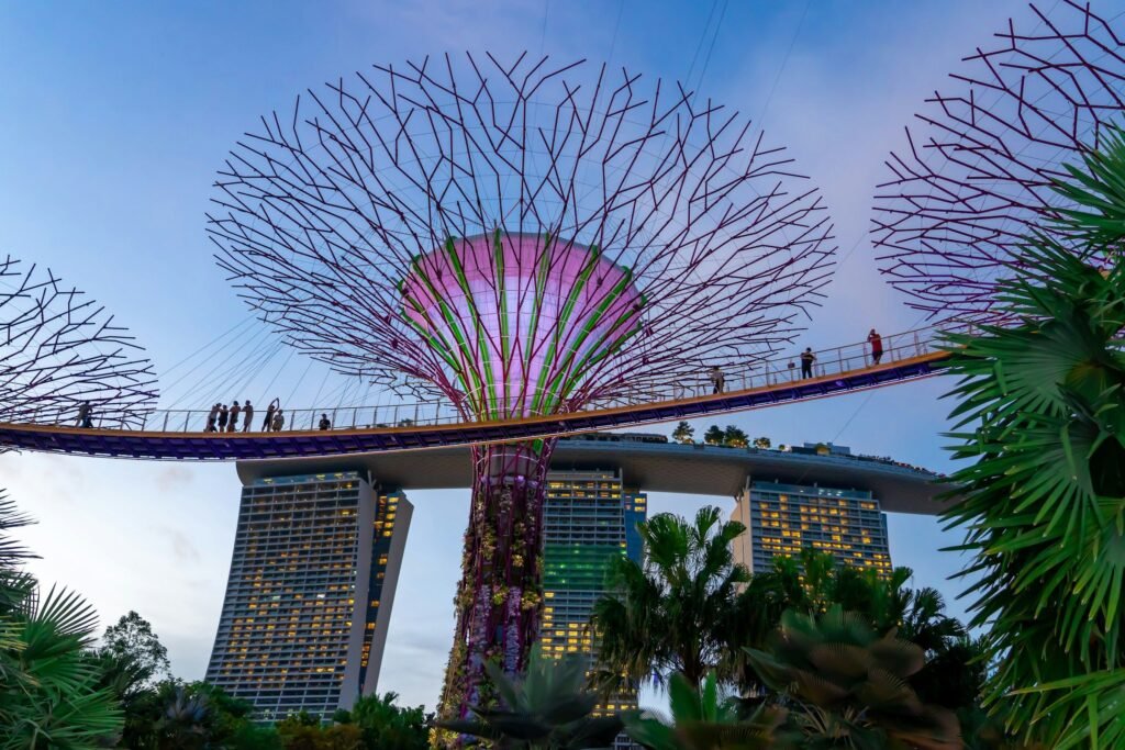 The Supertree Grove skyway at Gardens by the Bay, with Marina Bay Sands behind, Singapore